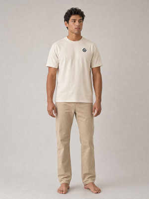 Coast Standard Tee in Ivory with navy wave mark, front on model