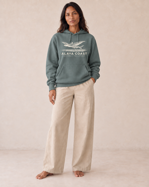 Batanes Flying Fish Hoodie in Alpine Green, front view on model