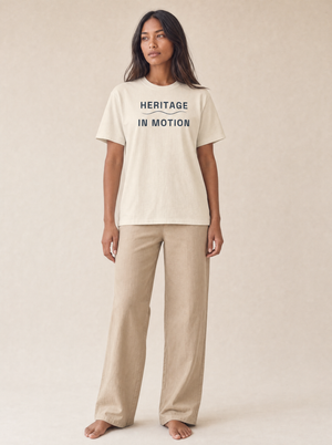 Coast Anthem Tee in Ivory with navy Heritage in Motion print, front on model