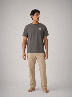 Coast Standard Tee in Ink with ivory wave mark, front on model