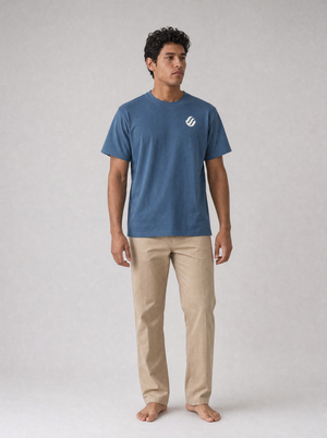 Coast Standard Tee in Navy with ivory wave mark, front on model